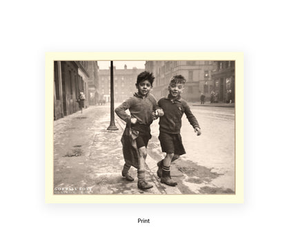 Sepia photographic print of two young boys walking in the Gorbals, Glasgow, 1948, street scene with tenement buildings