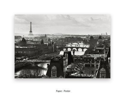 Black and white aerial Paris cityscape poster print showing Eiffel Tower in misty distance with River Seine bridges and Haussmann rooftops in foreground