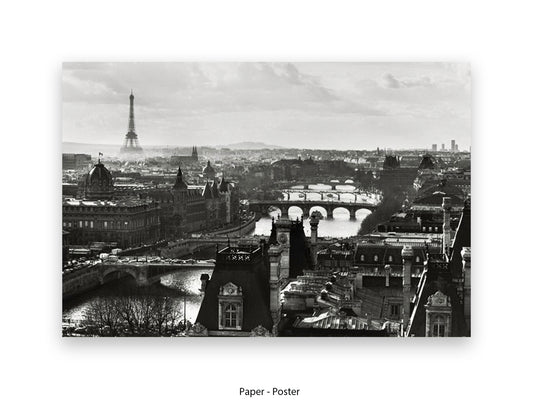 Black and white aerial Paris cityscape poster print showing Eiffel Tower in misty distance with River Seine bridges and Haussmann rooftops in foreground